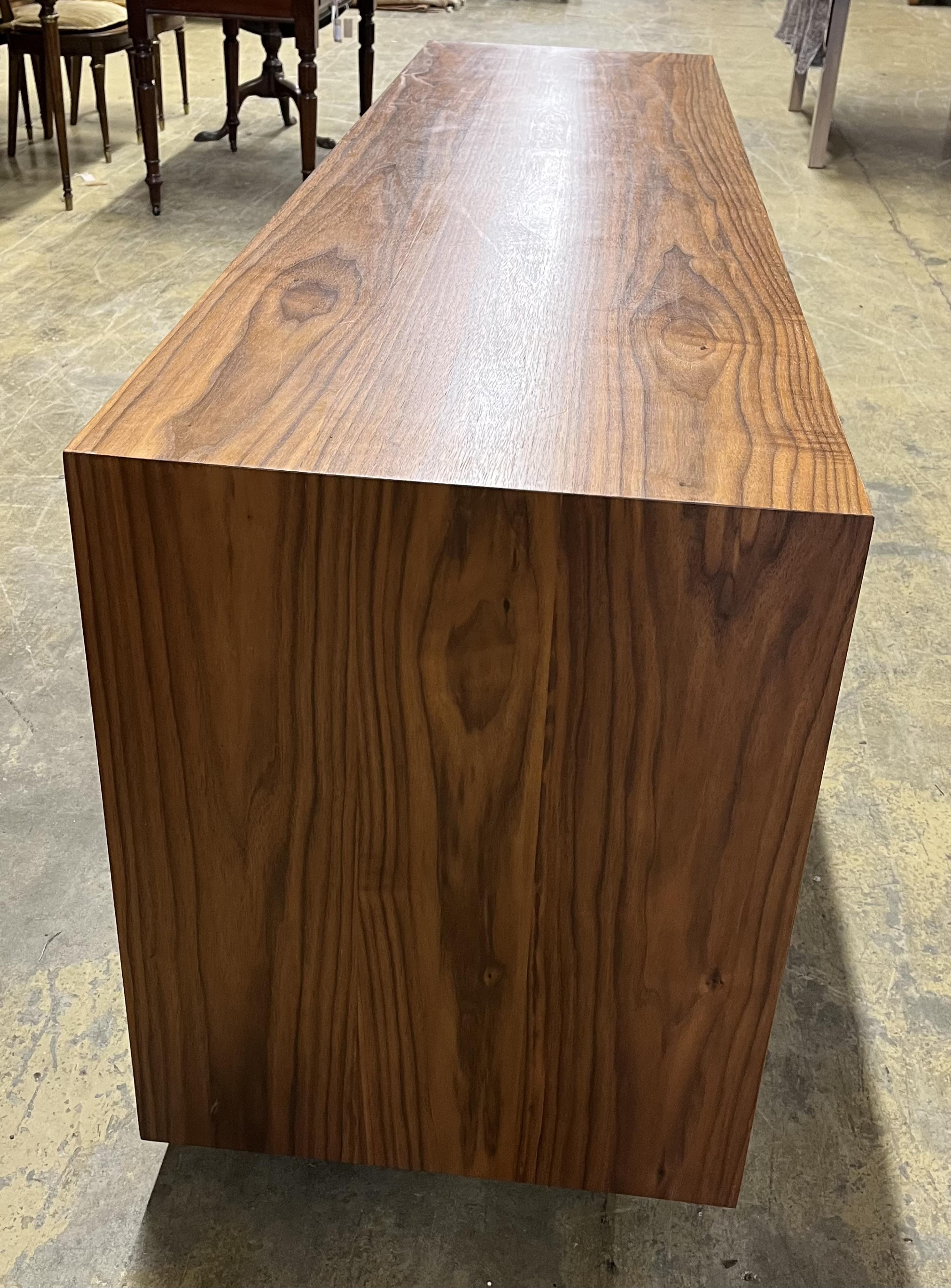 A Contemporary American black walnut sideboard, by Chartwood design Ltd., width 200cm, depth 55cm, height 77cm. Condition - fair to good